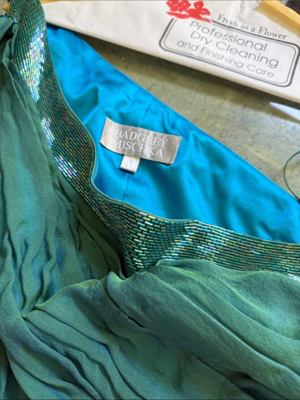 Green size 8 100% silk Badgley Mischka one shoulder dress
